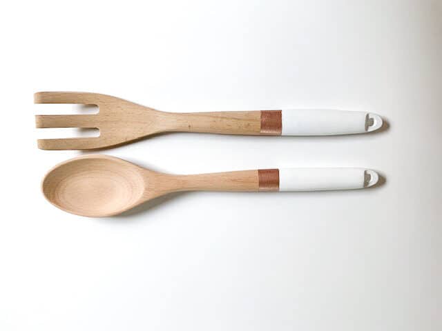 White and bronze painted salad server spoon and fork.