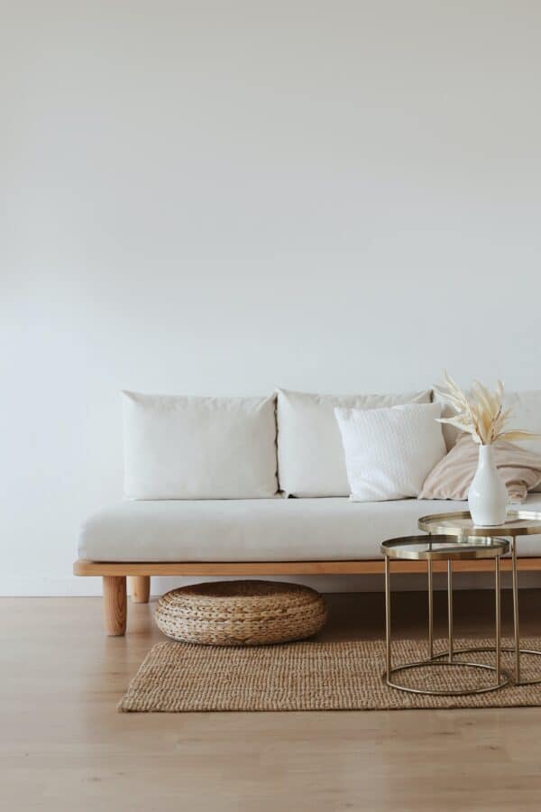 white sofa with cushions and coffee table.